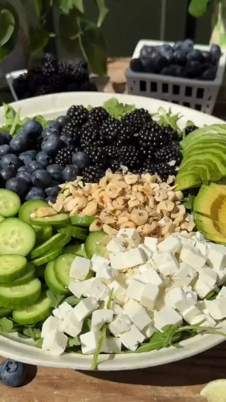 Blackberry Avocado Arugula Salad with Lime Dressing 4 Close-up of blackberries and avocado on peppery arugula with lime dressing drizzle