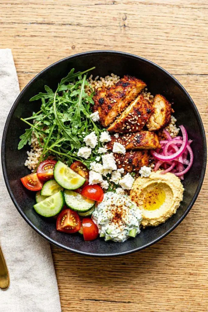 8 Healthy Mediterranean Diet Recipes for Beginners 3 Copycat CAVA bowl with harissa chicken, hummus and feta — easy Mediterranean diet recipe for beginners