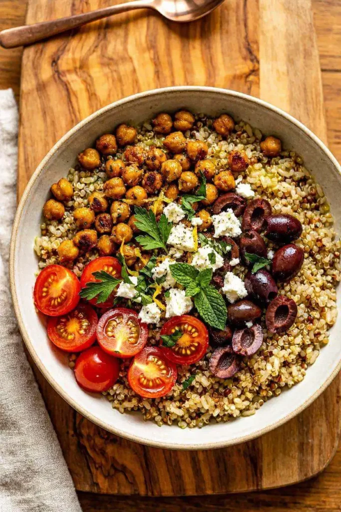 8 Healthy Mediterranean Diet Recipes for Beginners 6 Warm Mediterranean grain bowl with quinoa, roasted chickpeas and feta — healthy diet recipe